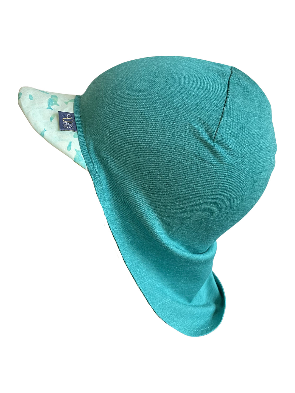 Original Glückskind Sommerkappe smaragd Fisch limited edition aus Merinowolle und Seide (bio/GOTS) - by heywool, Freisteller Seitenansicht #ay